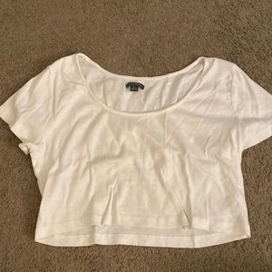 Crop top white t shirt. Good for going out to parties. Snug but a good fit